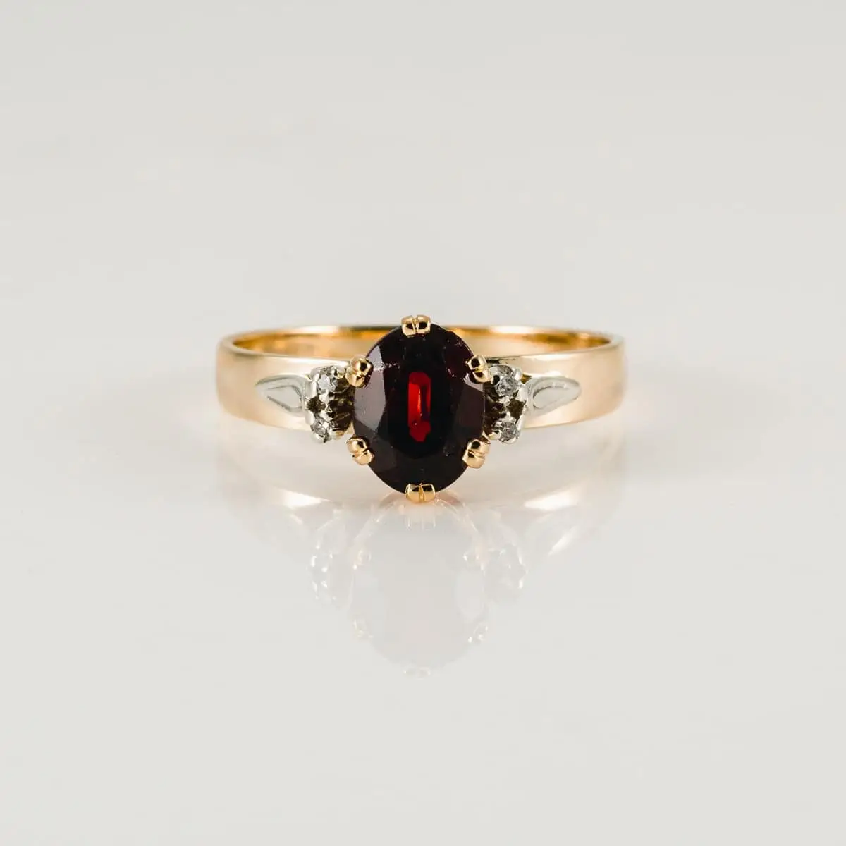 Restored garnet ring after the repair, polished and complete